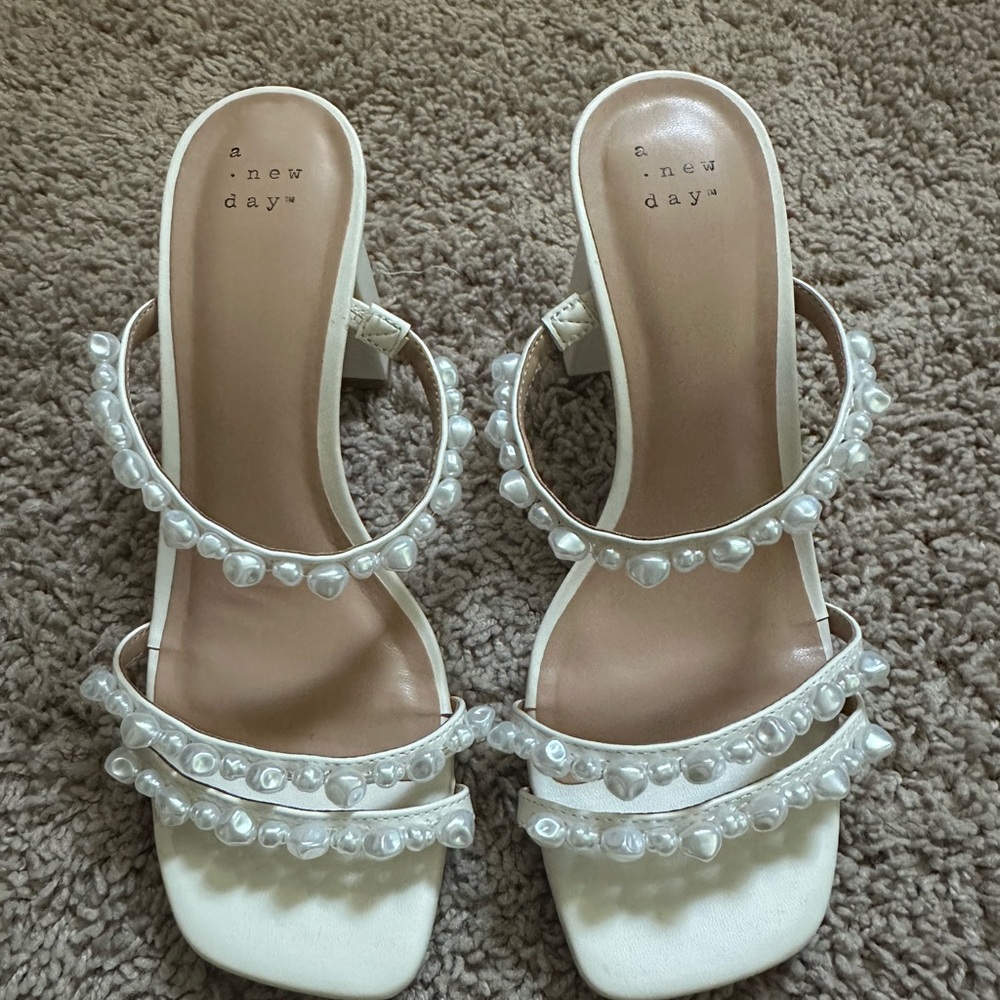 Pearl heels from Target. Never worn. Size 7 true to size.